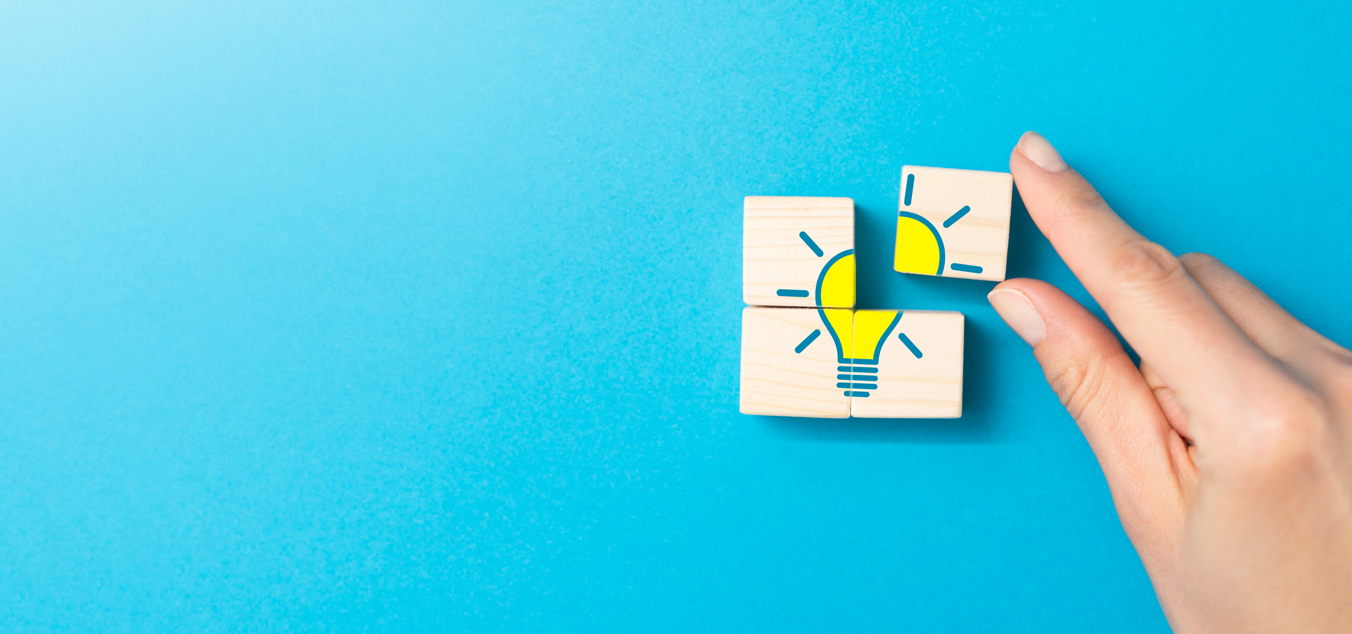 Creative Idea and Innovation Concept with Lightbulb Puzzle in Hand 